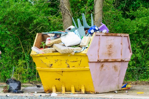 Workers clearing builder's waste in Muswell Hill